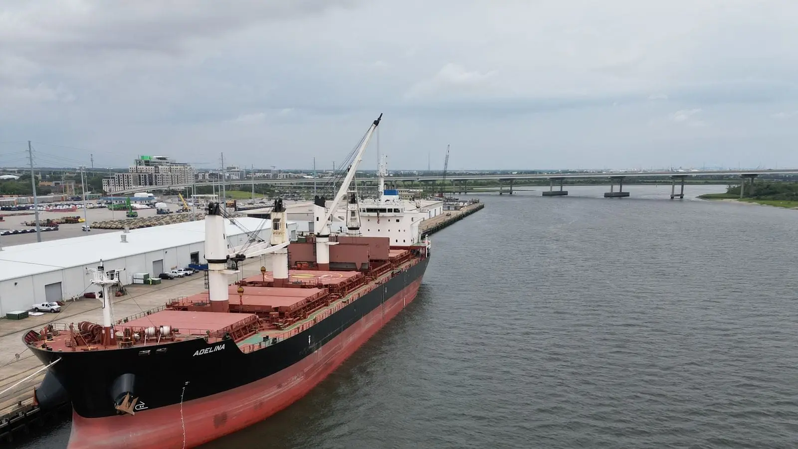 A cargo ship lying alongside a deep-water pier